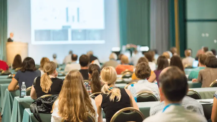 People attending conference session