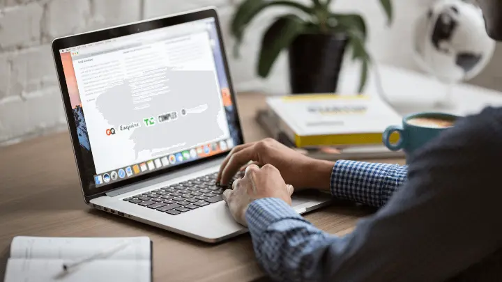 Man doing market research on laptop