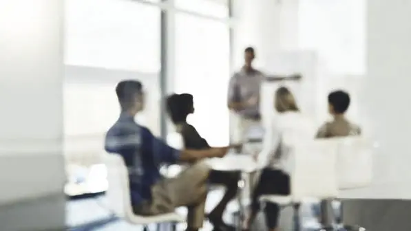 News Blog Image_ Defocused Business Meeting_iStockphoto-1133750656