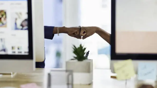 News Blog Image_Office Fist Bump_iStockphoto-1151370282