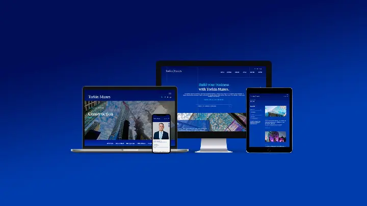 Laptop, mobile phone, desktop monitor, and tablet all open to Torkin Manes' website